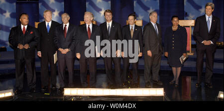 Nine Democratic presidential hopefuls, from left, Al Sharpton, Richard Gephardt, Wesley Clark, Joe Lieberman, John Edwards, Dennis Kucinich, Howard Dean, Carol Moseley Braun and John Kerry crowd the pre-primary race to decide who will take on President Bush in the 2004 election. The candidates are seen taking the stage on Oct. 26, 2003, before a debate at the Fox Theater in Detroit. To go with story US-LXN-DEMOCRATS.    (UPI/John  Martin) Stock Photo