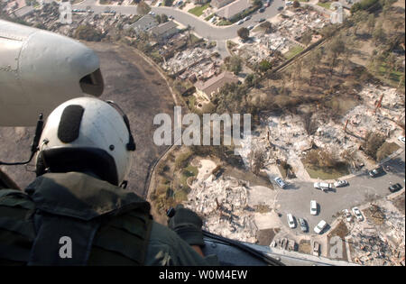 A view of the destroyed homes throughout the Scripps Ranch area of San Diego from a Sea King helicopter (UH-3H) assigned to the 'Golden Gators' of Reserve Helicopter Combat Support Squadron Eighty Five (HC-85), October 29. 2003  Wild fires have caused extensive damage throughout Southern California, scorching more than 500,000 acres or land.   (UPI/Michael Pusnik, Jr./Navy) Stock Photo