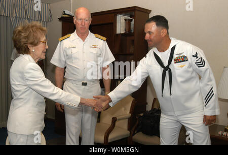 Former First Lady Nancy Reagan greets Aviation Structural Mechanic First Class Eric Bourbonnais, upon her arrival to Naval Air Station North Island.  Mrs. Reagan will make her first public appearance since the passing of President Ronald W. Reagan while honoring his namesake ship during a homeporting celebration at Naval Air Station North Island July 23, 2004.   (UPI Photo/Kleynia R. McKnight/US Navy) Stock Photo