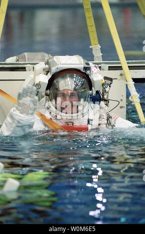 Space shuttle astronaut in EMU space suit at NASA Johnson Space Center ...