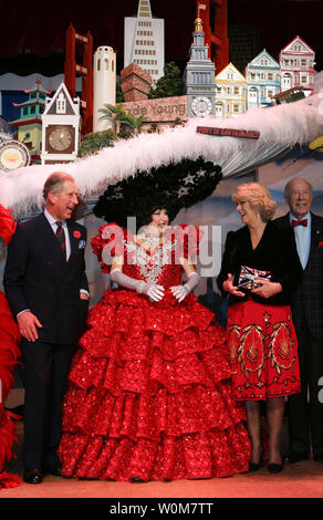 Prince Charles, left, and his wife, Camilla, right, Duchess of Cornwall, meets Val Diamond wearing a San Francisco Skyline Hat after they watched the musical performance of Beach Blanket Babylon in San Francisco, Sunday, Nov. 6, 2005. Charles and the Duchess of Cornwall are on a 8-day tour of the United States. (UPI Photo/Paul Sakuma/ Pool) Stock Photo