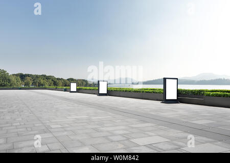 empty marble floor with beautiful lake in blue sky Stock Photo