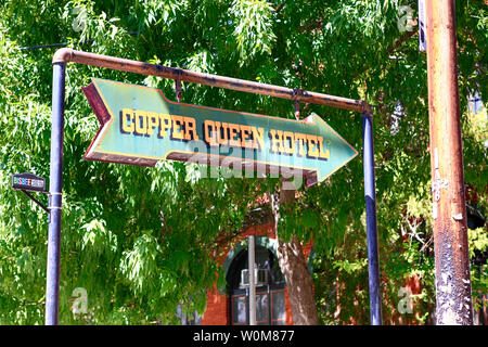 Overhead arrow sign pointing to the Copper Queen Hotel in downton historic Bisbee, AZ Stock Photo