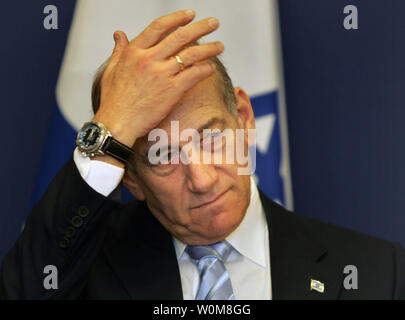Israeli Prime Minister Ehud Olmert, gestures during an official ceremony to transfer the control of  the Finance Ministry in Jerusalem on May 7,  2006. The new Israeli 25-member cabinet was sworn in last week.   (UPI Photo/Baz Ratner/ Pool) Stock Photo