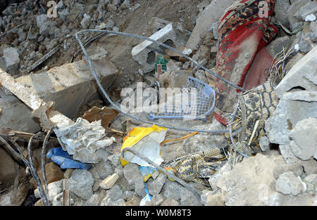 Household items lie among the rubble of a demolished home in Hebron ...