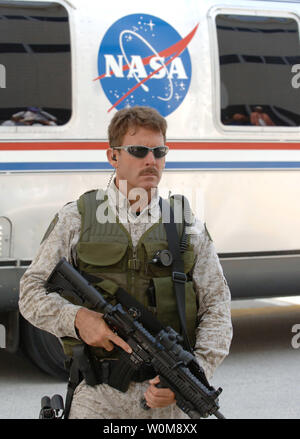 SWAT team member keeps high security during the walkout of the seven astronauts from the Operations and Checkout Building to board the NASA Astrovan en route to the Space Shuttle Discovery for mission STS-121 at Cape Canaveral, Florida on July 1, 2006.  (UPI Photo/Pat Benic) Stock Photo