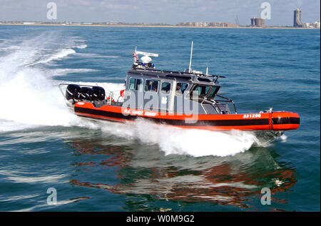 Crewmembers from Coast Guard Station South Padre Island, Texas, glide through the waters of the Gulf of Mexico in a 33-foot high-speed boat on Aug. 16, 2006. The station received three of these new boats in July of this year to increase the unit's law enforcement capabilities. The boat features three engines with 275 horsepower each. (UPI Photo/Coast Guard) Stock Photo