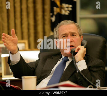 President George Bush gestures during his impromptu news conference at ...