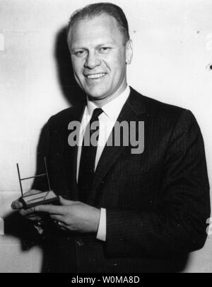 President Gerald Ford shown in a December 21, 1959 file photo, died at the age of 93 in his home in Rancho Mirage, California on December 26, 2006. Ford is pictured holding his Sports Illustrated Silver Anniversary Award. (UPI Photo/Gerald R. Ford Library) Stock Photo