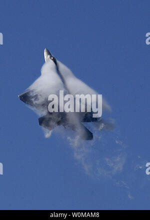 Water vapor forms around a U.S. Air Force F-22A Raptor in file photo as it maneuvers over the 42nd Naval Base Ventura County Air Show in Point Mugu, Calif., on April 1, 2007.  (UPI Photo/ U.S. Navy Petty Officer 2nd Class Jason R. Williams/FILE PHOTO) Stock Photo