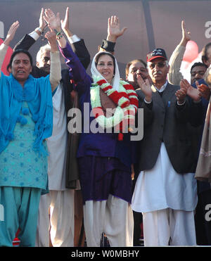 Pakistans opposition leader Benazir Bhutto, right, along with her