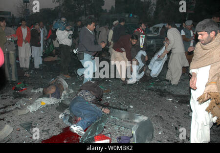 The Dead And Injured Are Taken Away After A Suicide Bomber Attacked An ...