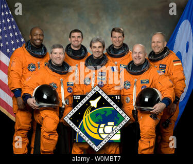 The NASA mission STS-122 official crew portrait. From the left (front row) are astronauts Stephen N. Frick, commander; European Space Agency's (ESA) Leopold Eyharts; and Alan G. Poindexter, pilot. From the left (back row) are astronauts Leland D. Melvin, Rex J. Walheim, Stanley G. Love and European Space Agency's (ESA) Hans Schlegel, all mission specialists. Eyharts will join Expedition 16 in progress to serve as a flight engineer aboard the International Space Station. The crewmembers are attired in training versions of their shuttle launch and entry suits. (UPI Photo/NASA) Stock Photo