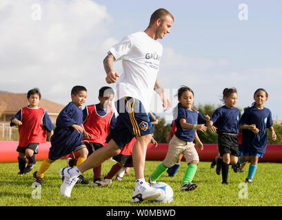 19 February 2008: LA Galaxy's David Beckham plays a game with young soccer players during a community event at Waianae High School for the 2008 Pan-Pacific Championship in Hawaii on February 19, 2008. Players from both Gamba Osaka and LA Galaxy were present.   (UPI Photo/Jordan Murph/PPC/SUM) Stock Photo