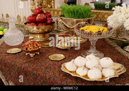 A traditional Haft Sin table celebrating Nowruz, the Persian New Year, is seen set Wednesday, March 19, 2008, in the State Dining Room of the White House in Washington. Nowruz is, in Persian and some other cultures, including Kurdish culture, a family-oriented holiday celebrating the New Year and the coming of spring. The Haft Sin table has seven items symbolizing new life, joy, love, beauty and health, sunrise, patience and garlic to ward off evil. (UPI Photo/Chris Greenberg/White House) Stock Photo