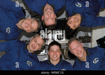 The STS-123 crew are pictured on the International Space Station on March 24, 2008. Clockwise from the lower right corner are astronauts Dominic Gorie, commander; Robert L. Behnken and Rick Linnehan, both mission specialists; Gregory H. Johnson, pilot; and Mike Foreman and JAXA's Takao Doi, both mission specialists. (UPI Photo/NASA) Stock Photo