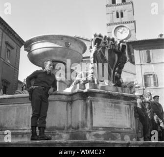 Charlton Heston died at the age of 84 at his home in Beverly Hills on April 5, 2008. He is seen in this undated file photo standing near an old water fountain in Rome dressed as a soldier during the filming of 'The Pigeon That Took Rome,' which premiered in 1961. (UPI Photo/Files) Stock Photo