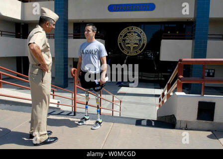 Master Chief Petty Officer of the Navy Joe R. Campa Jr. (L) speaks to U.S. Army Spec. Joseph Serino (R) outside the Naval Medical Center in San Diego, California on June 17, 2008. Serino was injured by an improvised explosive device in southern Baghdad on June 16, 2007. Campa is the highest-ranking Navy enlisted Sailor. (UPI Photo/MC1 Jennifer A. Villalovos/U.S. Navy) Stock Photo
