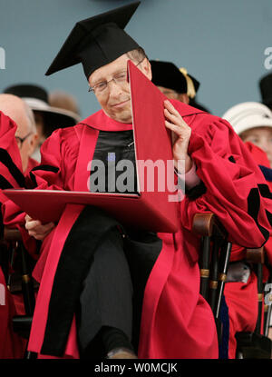 Microsoft Chairman Bill Gates steps down today, June 27, 2008, from his daily duties from the company he co-founded 33 years ago. Gates will devote more time to the $29.1 billion Bill and Melinda Gates Foundation, the company said. A Harvard drop-out himself, he is seen looking at his honorary degree during the 2007 Harvard University Commencement Exercises in Cambridge, Massachusetts on June 7, 2007.  (UPI Photo/Matthew Healey/FILES) Stock Photo