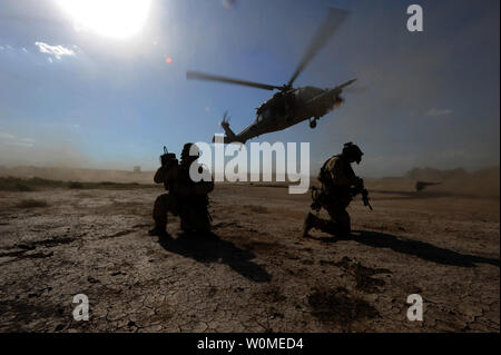 U.S. Air Force pararescuemen prepare to board an HH-60 Pave Hawk helicopter during proficiency training outside Baghdad, Iraq, on April 10, 2009.  (UPI Photo/James L. Harper Jr./U.S. Air Force) Stock Photo
