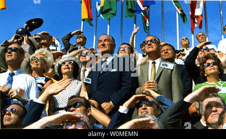 Vice President Spiro Agnew and former President Lyndon B. Johnson (C) view the liftoff of Apollo 11 from pad 39A at Kennedy Space Center, Flordia at 9:32 am EDT on July 16, 1969. NASA marks the 40th anniversary of the Apollo 11 mission to the Moon and the historic first 'moonwalk' this year. During the eight-day space mission, Armstrong and Aldrin explored the Moon's surface and brought back rock samples for scientists to study. Collins piloted the command module in the lunar orbit during their 22-hour stay on the moon. (UPI Photo/NASA) Stock Photo