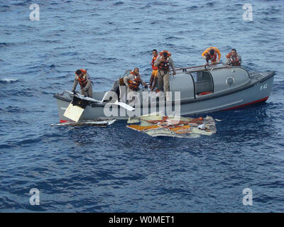 In this photo released by the Brazilian Air Force members of Brazil's Navy recover debris from the missing Air France jet in the Atlantic Ocean, June 7, 2009. The U.S. Navy is sending a team equipped with underwater listening devices to assist in the search for the missing black box. (UPI Photo/Brazilian Air Force ) Stock Photo