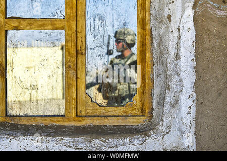 U.S. Army Staff Sgt. Mark Oravsky, with 4th Battalion, 23rd Infantry Regiment, 5th Brigade, 2nd Infantry Division, provides security at Suri Elementary School in the Suri Bazaar, Zabul province, Afghanistan, November 14, 2009. Afghan National Army soldiers and U.S. Soldiers are meeting with the school's teachers to identify and discuss potential improvement opportunities.    UPI/Efren Lopez/USAF Stock Photo