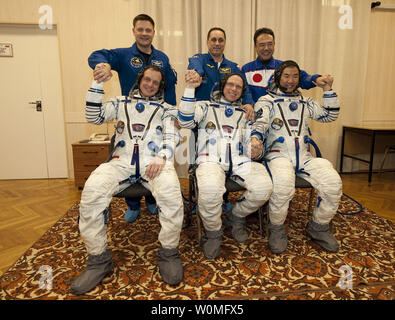 Expedition 22 crew members, seated from left, NASA Flight Engineer Timothy J. Creamer of the U.S., Soyuz Commander Oleg Kotov of Russia, and Flight Engineer Soichi Noguchi of Japan and their backup crew members, standing from left, NASA's Doug Wheelock, Russian Anton Shkaplerov and Japan's Satoshi Furakawa, pose for a group photo shortly after donning their flight suits a few hours before the scheduled launch of the Soyuz TMA-17 spacecraft from the Baikonur Cosmodrome in Kazakhstan, on December 20, 2009.   UPI/Bill Ingalls/NASA Stock Photo