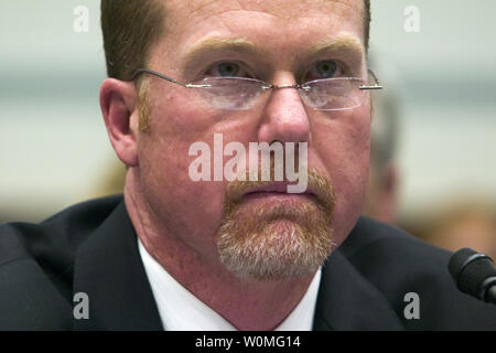 Former Major League Baseball player Mark McGwire, shown in this March 17, 2005 file photo testifying in Washington before the House Committee on Government Reform about the use of steroids in Major League Baseball, has announced that he used steroids when he broke baseball's home run record in 1998.    UPI Photo/Michael Kleinfeld/FILE Stock Photo