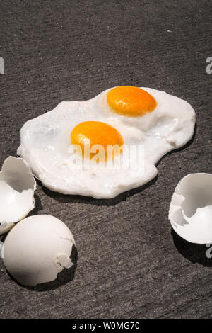 The expression 'it's hot enough to fry eggs on a sidewalk' is used during a heatwave, USA Stock Photo