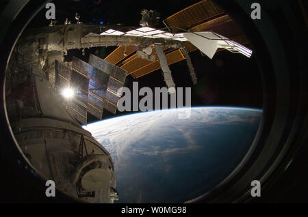 Backdropped by Earth's horizon and the blackness of space, a portion of the International Space Station is featured in this image photographed by a crew member on the ISS while space shuttle Endeavour STS-130 mission remains docked with the station on February 15, 2010 UPI/NASA Stock Photo