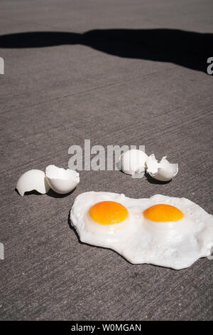 The expression 'it's hot enough to fry eggs on a sidewalk' is used during a heatwave, USA Stock Photo