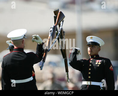 Marines, with the United States Marine Corps Silent Drill Platoon from Marine Barracks 8th and I in Washington, perform an inspection of their rifles during their show at the Combat Center's Lance Cpl. Torrey L. Gray Field in California on March 16, 2010. UPI/Jeremiah Handeland/U.S. Marines Stock Photo