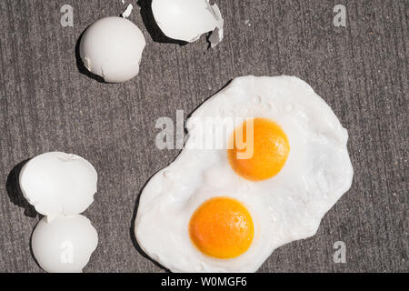 The expression 'it's hot enough to fry eggs on a sidewalk' is used during a heatwave, USA Stock Photo