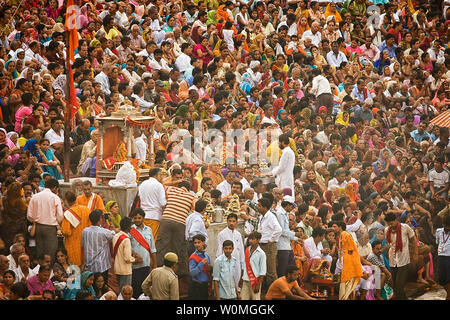 Hindu devotees line up to take a holy bath in the Ganges River during the Kumbha Mela festival in Haridwar, India on April 15, 2010.  The pilgrimage takes place every three years, rotating amongst four different locations in India, thus, once every 12 years in each location.  It lasts for 42 days attracting millions of people, and this year ends on April 28, 2010.   Devotees believe that taking a bath in the river will wash their sins away so they begin life anew.    UPI/Maryam Rahmanian Stock Photo