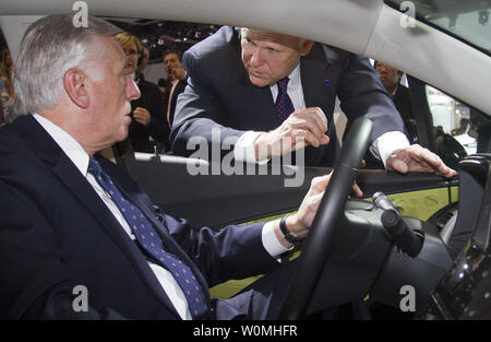 General Motors Chairman and CEO Dan Akerson (right) talks with Congressmen Steny Hoyer as he sits in a Chevrolet Volt electric vehicle with extended range capabilities  Monday, January 10, 2011 at the North American International Auto Show on in Detroit, Michigan.    UPI/Jeffrey Sauger/Chevrolet Stock Photo