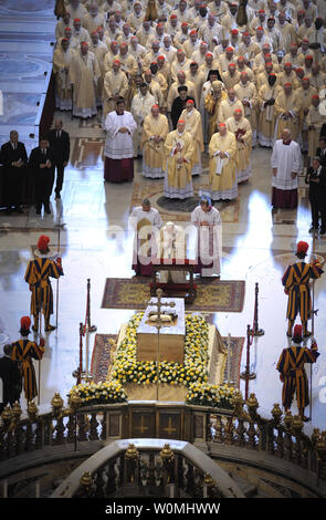 Pope Benedict XVI kneels before the coffin of his predecessor Pope John Paul II in St. Peter's Basilica in the Vatican following his beatification on May 1, 2011.   UPI/Stefano Spaziani Stock Photo