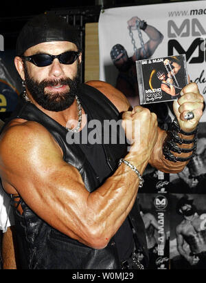 WWF superstar 'Macho Man' Randy Savage died in a car crash Friday morning in Tampa, Florida, on May 20, 2011, according to reports. The 58-year-old wrestler reportedly suffered a heart attack while driving and lost control of his vehicle. He is shown on October 7, 2003 during an instore promo in New York City to launch his musical debut album 'Be A Man.'   UPI/Ezio Petersen/FILE Stock Photo