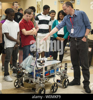 SpacePRIDE Team members Mark Curry, right, answer questions from 8th grade Sullivan Middle School (Mass.) students about their robot on Friday, June 15, 2012 at the Worcester Polytechnic Institute (WPI) in Worcester, Mass.  SpacePRIDE's robot team will compete for a $1.5 million NASA prize in the NASA-WPI Sample Return Robot Centennial Challenge at WPI.  Teams have been challenged to build autonomous robots that can identify, collect and return samples.  NASA needs autonomous robotic capability for future planetary exploration. UPI/Bill Ingalls/NASA Stock Photo