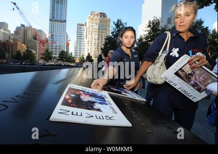 Christine Box, sister of firefighter Gary Box of Squad 1, remembers her brother with her daughter Nikki Silva during observances held on the eleventh anniversary of the attacks on the World Trade Center, at the site in New York, September 11, 2012. UPI/Todd Maisel   POOL Stock Photo
