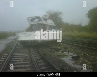 This photo released on October 30, 2012 shows a boat as it rests on the tracks of Metro-North's Hudson Line in New York in the aftermath of Hurricane Sandy. The super storm brought tropical storm force winds and a massive storm surge as it made landfall last night in New Jersey. The storm has claimed at least 16 lives in the United States, and has caused massive flooding across much of the eastern seaboard.  UPI/MTA Stock Photo