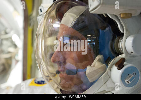 Expedition 35 Flight Engineer Chris Cassidy, who currently is living and working aboard the International Space Station, is captured in a close-up image in the Quest Airlock prior to a spacewalk in May, 2013.  UPI/NASA