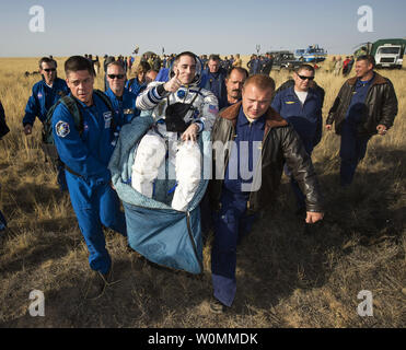 Expedition 36 Flight Engineer Chris Cassidy of NASA is carried to the medical tent shortly after he and, Commander Pavel Vinogradov of Russian Federal Space Agency (Roscosmos), and Flight Engineer Alexander Misurkin of Roscosmos landed in their Soyuz TMA-08M capsule in a remote area near the town of Zhezkazgan, Kazakhstan, on Wednesday, Sept. 11, 2013. Vinogradov, Misurkin and Cassidy returned to Earth after five and a half months on the International Space Station. UPI/ Bill Ingalls /NASA Stock Photo
