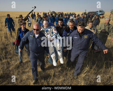Expedition 36 Flight Engineer Alexander Misurkin of the Russian Federal Space Agency (Roscosmos) is carried to the medical tent shortly after he and Commander Pavel Vinogradov of Roscosmos, and Flight Engineer Chris Cassidy of NASA landed in their Soyuz TMA-08M capsule in a remote area near the town of Zhezkazgan, Kazakhstan, on Wednesday, Sept. 11, 2013. Vinogradov, Misurkin and Cassidy returned to Earth after five and a half months on the International Space Station. UPI/Bill Ingalls/NASA Stock Photo