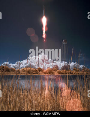 The Orbital Sciences Corporation Antares rocket, with the Cygnus cargo spacecraft aboard, is seen in this false color infrared image as it launches from Pad-0A of the Mid-Atlantic Regional Spaceport (MARS) at NASA Wallops Flight Facility, Virginia on September 18, 2013, . Cygnus is on its way to rendezvous with the International Space Station. The spacecraft will deliver about 1,300 pounds (589 kilograms) of cargo, including food and clothing, to the Expedition 37 crew.   UPI/Bill Ingalls/NASA