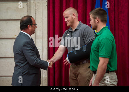 U.S. Airman 1st Class Spencer Stone shakes hands with French President Francois Hollande after being awarded the Legion of Honor at his home in Paris Aug. 24, 2015, following a foiled attack on a French train. Stone was on vacation with his childhood friends, Aleksander Skarlatos and Anthony Sadler, when an armed gunman entered their train carrying an assault rifle, a handgun and a box cutter. The three friends, with the help of a British passenger, subdued the gunman after his rifle jammed. The four men were aware the Legion of Honor for their bravery.  U.S. Air Force Photo/Ryan Crane/UPI Stock Photo