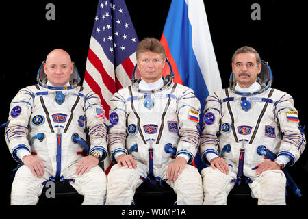 The prime crew members for International Space Station Expedition 43 take a break in training  for a crew portrait on February 6, 2015. From the left are Flight Engineers Scott Kelly of NASA, Gennady Padalka and Mikhail Kornienko of Russia's Federal Space Agency (Roscosmos.) ..Part of NASA's Human Research Program, the One-Year Mission on the International Space Station is a joint effort between the U.S. space agency, the Russian Federal Space Agency (Roscosmos) and their international partners. The mission is part of a scientific research project studying long term spaceflight and the effects Stock Photo