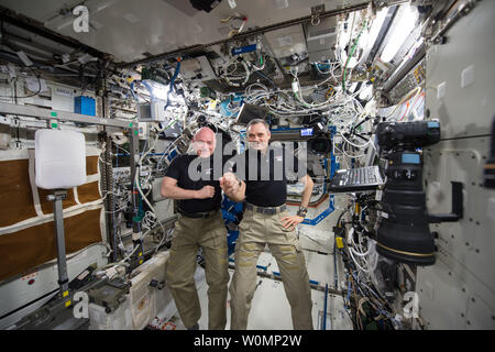 NASA astronaut Scott Kelly (left) and Russian cosmonaut Mikhail Kornienko (right) marked their 300th consecutive day aboard the International Space Station on January 21, 2016. ..Part of NASA's Human Research Program, the One-Year Mission on the International Space Station is a joint effort between the U.S. space agency, the Russian Federal Space Agency (Roscosmos) and their international partners. The mission is part of a scientific research project studying long term spaceflight and the effects it has on the human body...NASA astronaut Scott Kelly and Russian cosmonaut Mikhail Kornienko, bot Stock Photo