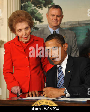 In this file photo, President Barack Obama signs the Ronald Reagan Centennial Commission Act as former first lady Nancy Reagan watches at the White House in Washington on June 2, 2009. Former first lady Nancy Reagan died at her home in Los Angeles at 94 on March 6, 2016.    (UPI Photo/Kevin Dietsch) Stock Photo