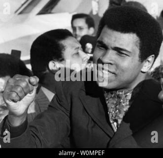 Boxing great Muhammad Ali died at the age of 74 in Phoenix, Arizona on Saturday, June 4, 2016.  He is shown  acknowledging cheers of the crowd at Chicago's Midway Airport on November 1, 1974, after his arrival from Zaire, Africa, where he beat George Foreman to regain his world heavyweight boxing title.   File Photo by Ray Foli/UPI Stock Photo